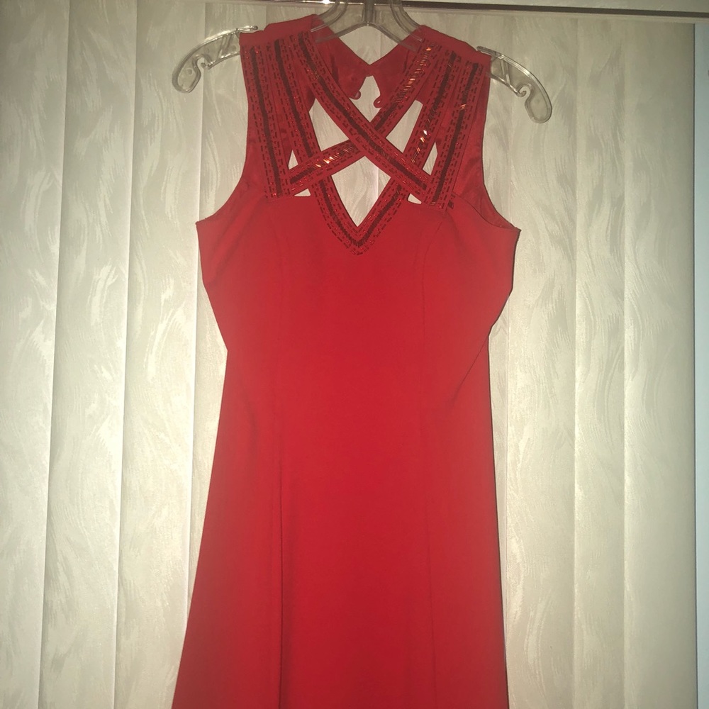 Red flowy dress with sequin design and open back